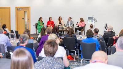 Full room watching panel discussion